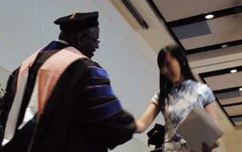 Dr. Darrin Thorton congratulating 2012 Phi Kappa Phi initiate #14.