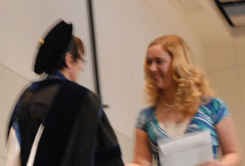 Dr. Sharon Falcone Miller congratulating 2012 Phi Kappa Phi initiate #2.