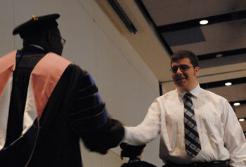 Dr. Darrin Thorton congratulating 2012 Phi Kappa Phi initiate #21.